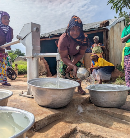 women fetching water from a borehole